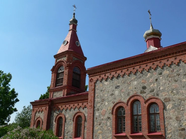 a large brick building with towers on both sides