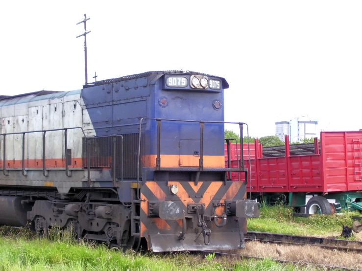 an old train engine parked in a yard