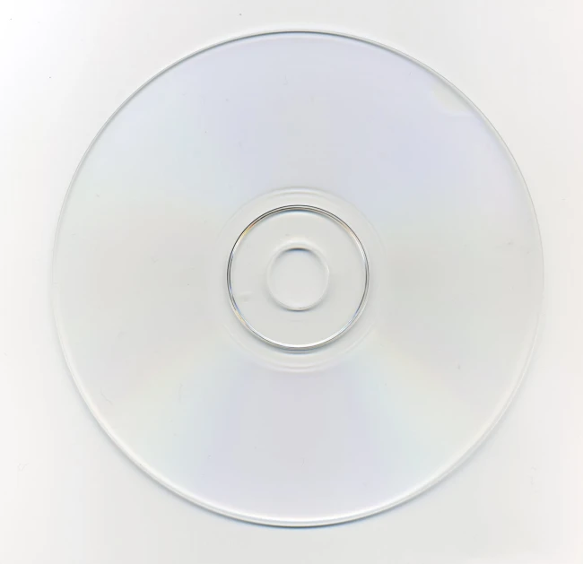 a white plastic disc sitting on top of a counter