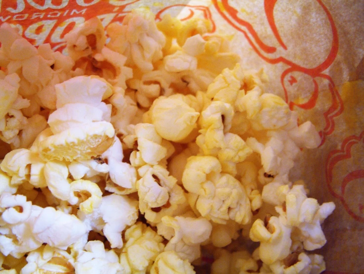 a mixture of popcorn, including a bite taken out of one