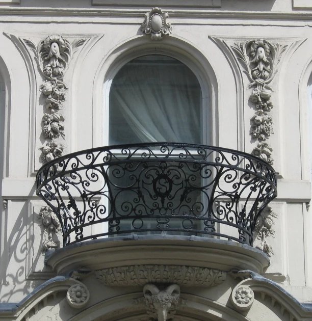 a balcony with a railing and an ornate design