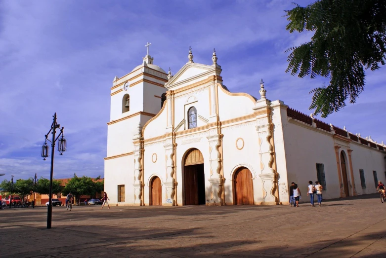 a large church with people walking through it