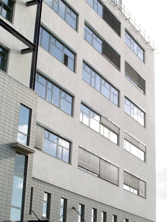 a white building with many windows on it's side