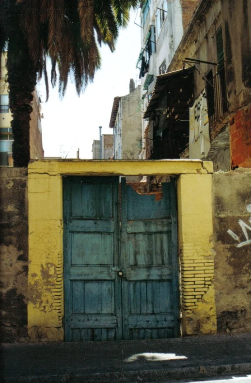 two large doors are open in front of an older building