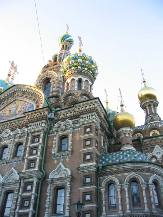 an ornate building with many dome tops and gold domes