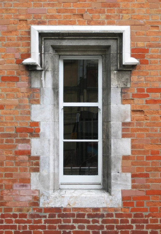 a close up of a window on a brick building