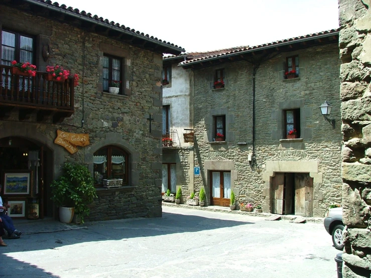 there is a building with a stone courtyard