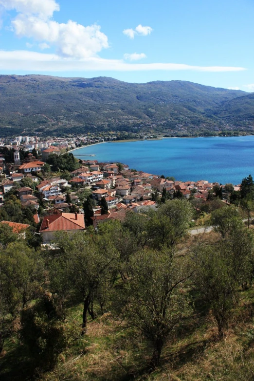 a scenic area is shown with small blue waters in the distance