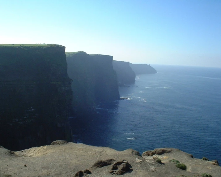 an expanse of water between two cliff sides