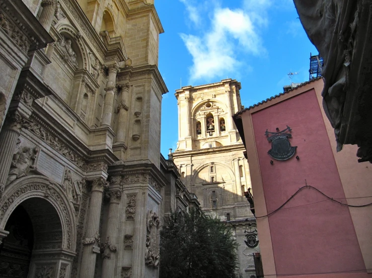 an ornate and old building that's seen from below