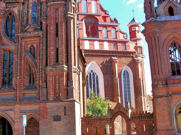 two towers of a church with stained glass windows