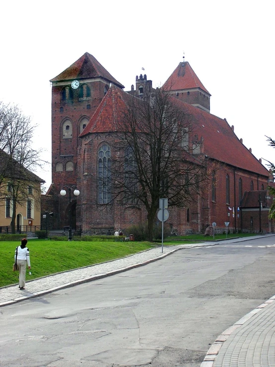 a person stands in front of a building