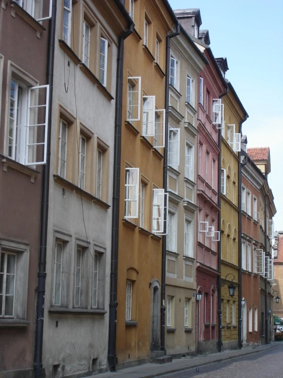 a narrow city street with several different buildings