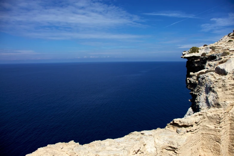 an image of a rocky cliff near the ocean