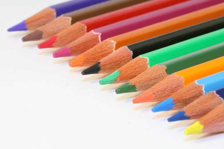 the colorful pencils are lined up neatly