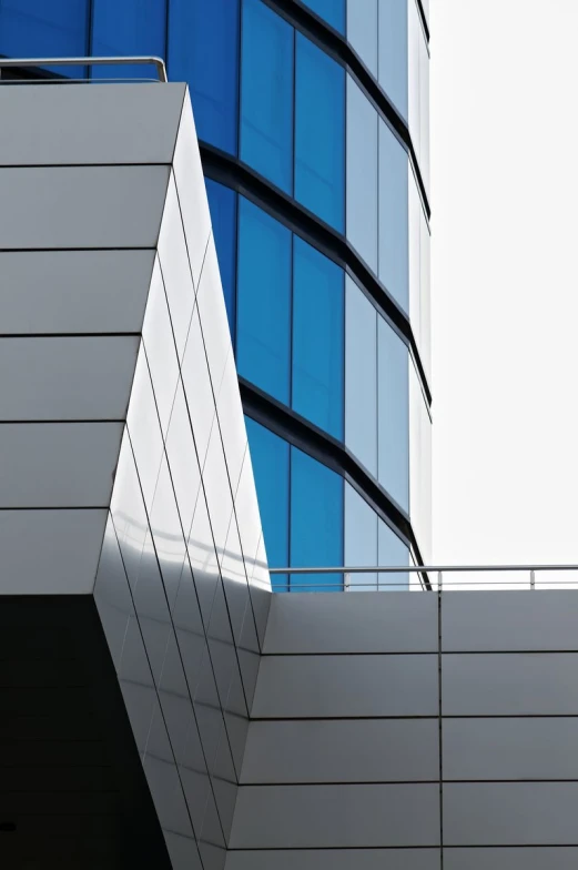 a tall white building with a street sign in front of it