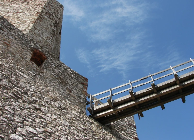 a bridge runs across a small section of stone