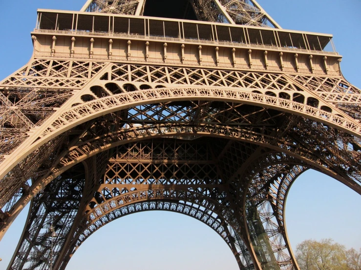 the view of a tall metal structure with people below