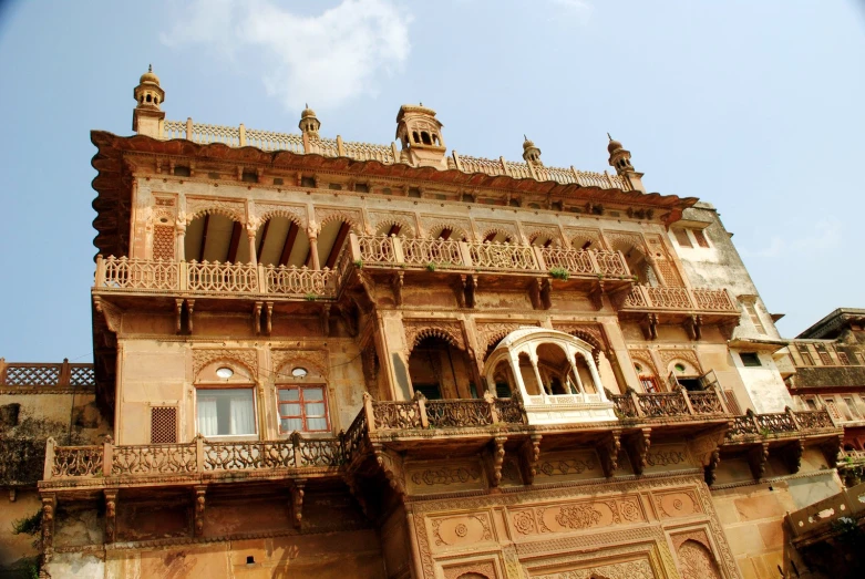 an old building with balconies has a balcony and balconies