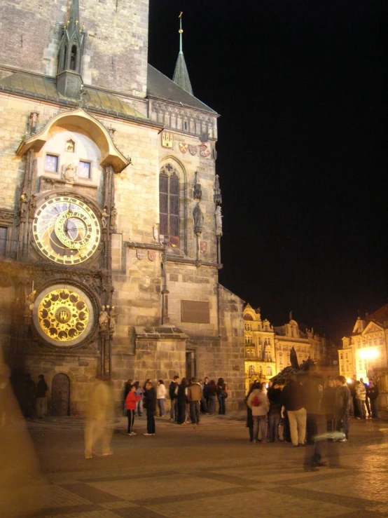 there is a building with many clocks on it