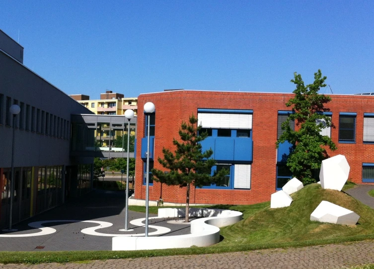 a large building with grass in front