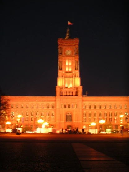 the illuminated palace building is illuminated with lighting