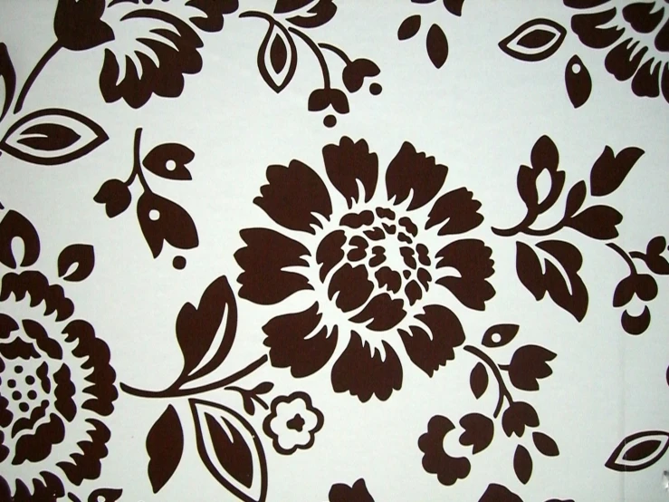 a pattern of brown and white flowers on a white background