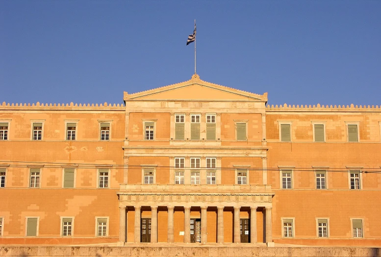 this is a large building with two flags on top