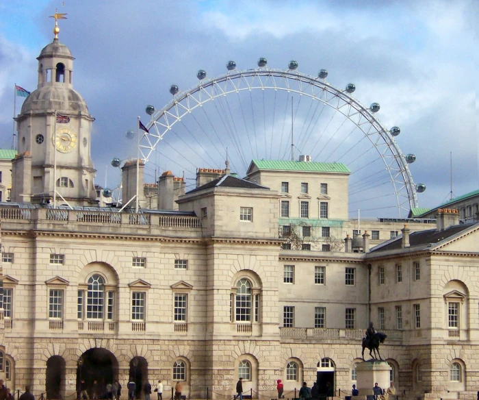 a large building that has a ferris wheel on top