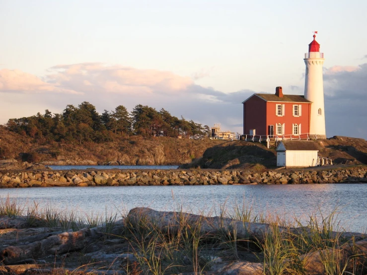 a lighthouse with a boat out on the water