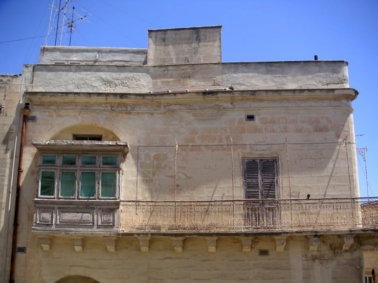 a view from below the side of an old building