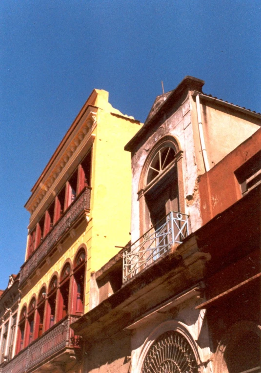 an image of a building that is yellow and brown