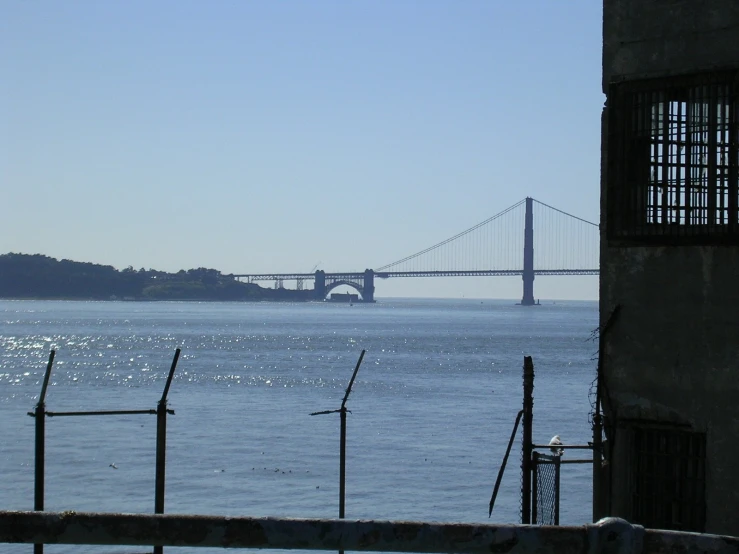 a view of a large bridge spanning across a wide ocean