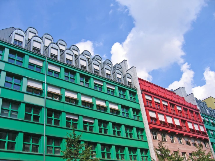 two buildings stand side by side, with windows on each