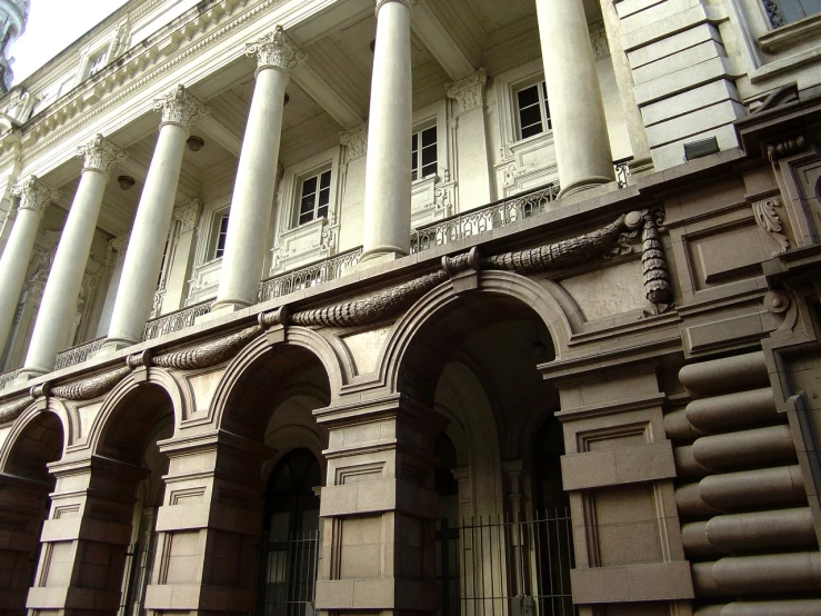 the back wall of a building with columns and pillars