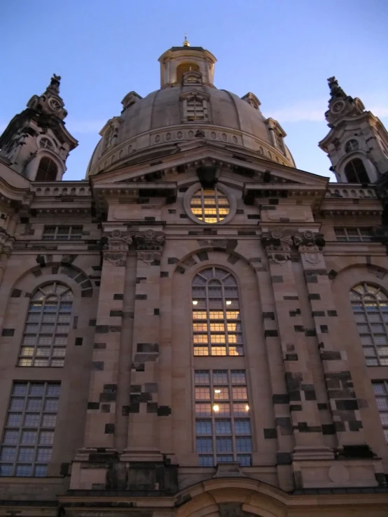 a building with two towers on top and windows