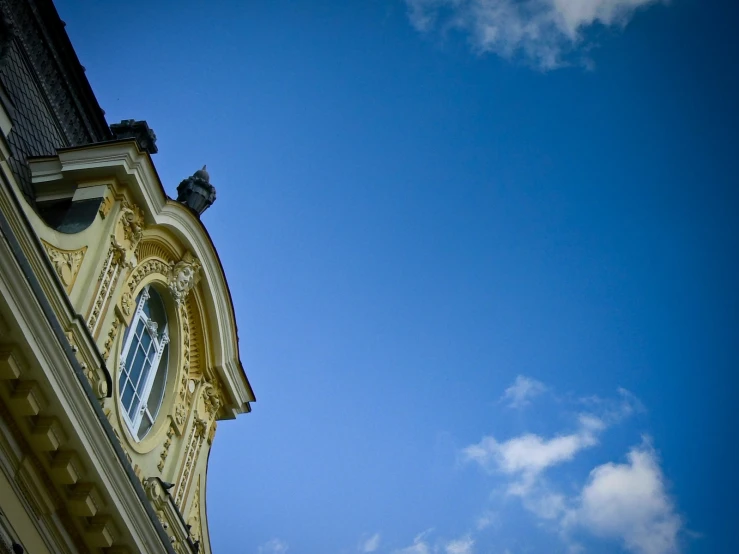 clock tower on top of building with a blue sky in the background