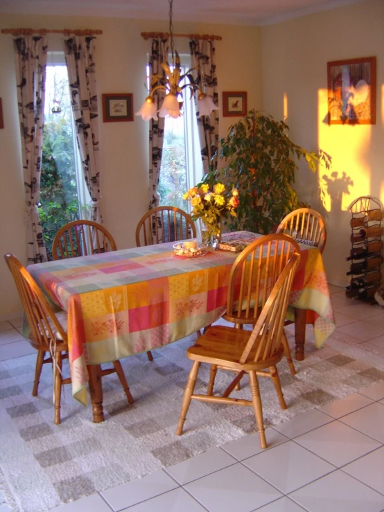 a dining room table has a colorful pattern on it