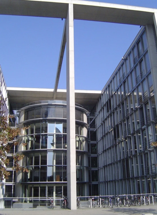 a very tall, slender building sitting next to some trees