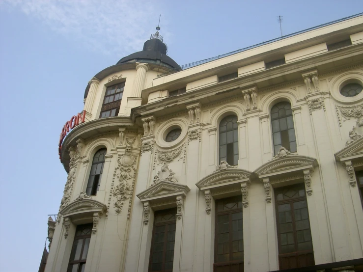 a very large building with an ornate and decorative front and side