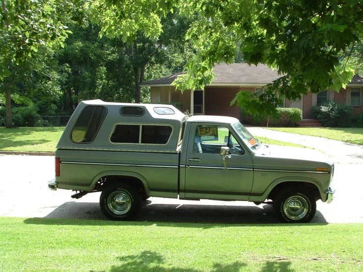 a silver truck sitting in a parking lot