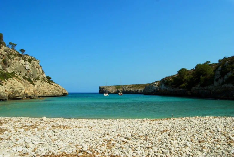 there are a couple boats that can be seen in the water