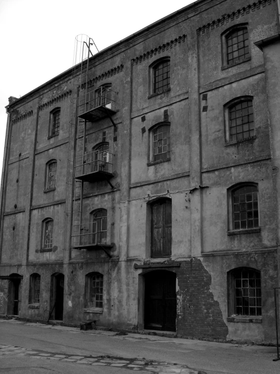 the corner of an old, rundown building in an otherwise older part of town