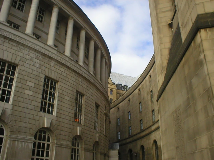 the building's two arches are empty but there are buildings on each side of it