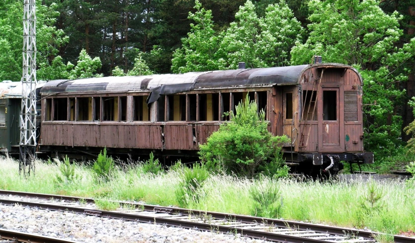 the old train has been abandoned on the tracks