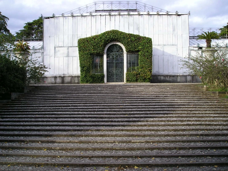 an outdoor stairwell leads up to an entrance