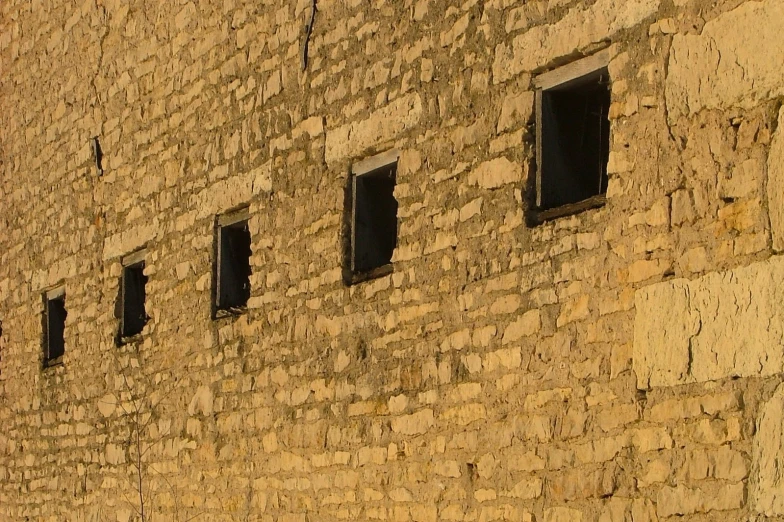 the old brick building has a few small windows