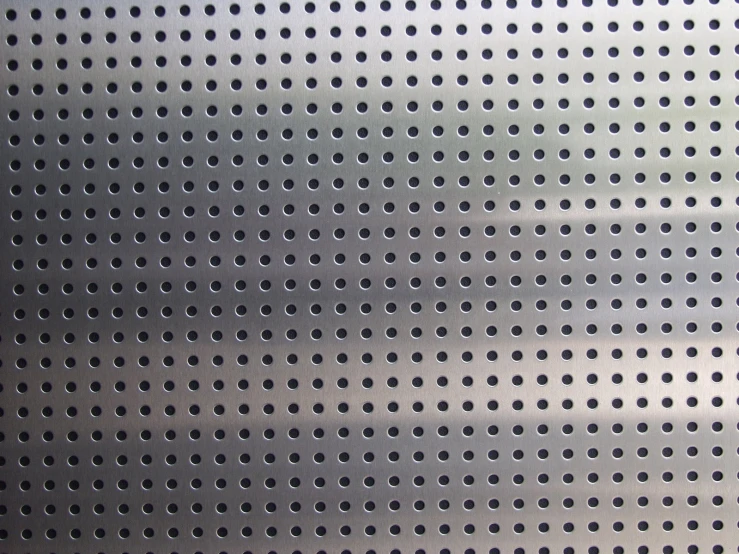 a wall with holes that are slightly blurry