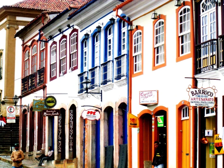 an array of colorful buildings line the street