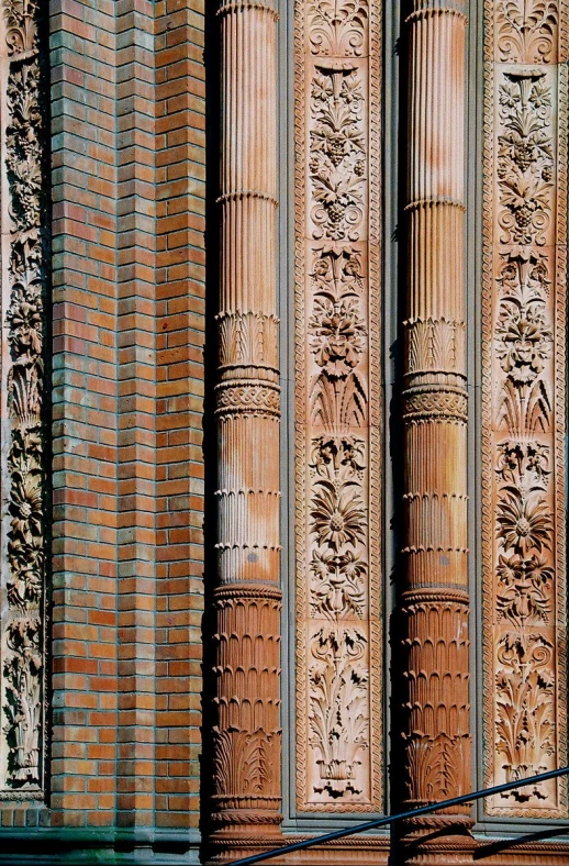 a decorative brick wall with carvings on it